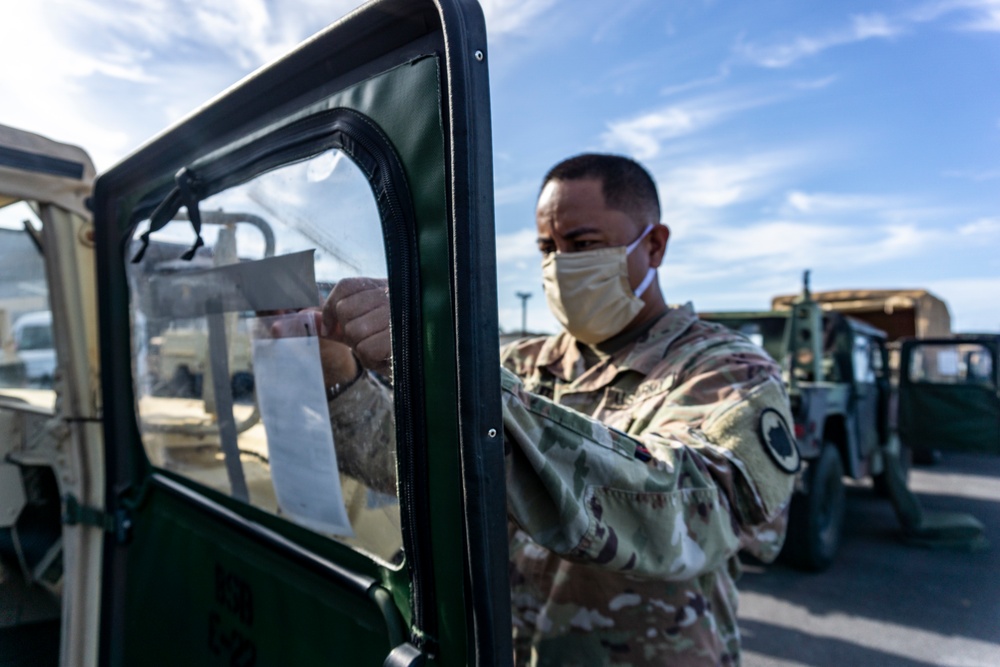 Soldiers and Airmen hold joint inspection for vehicle airlift op