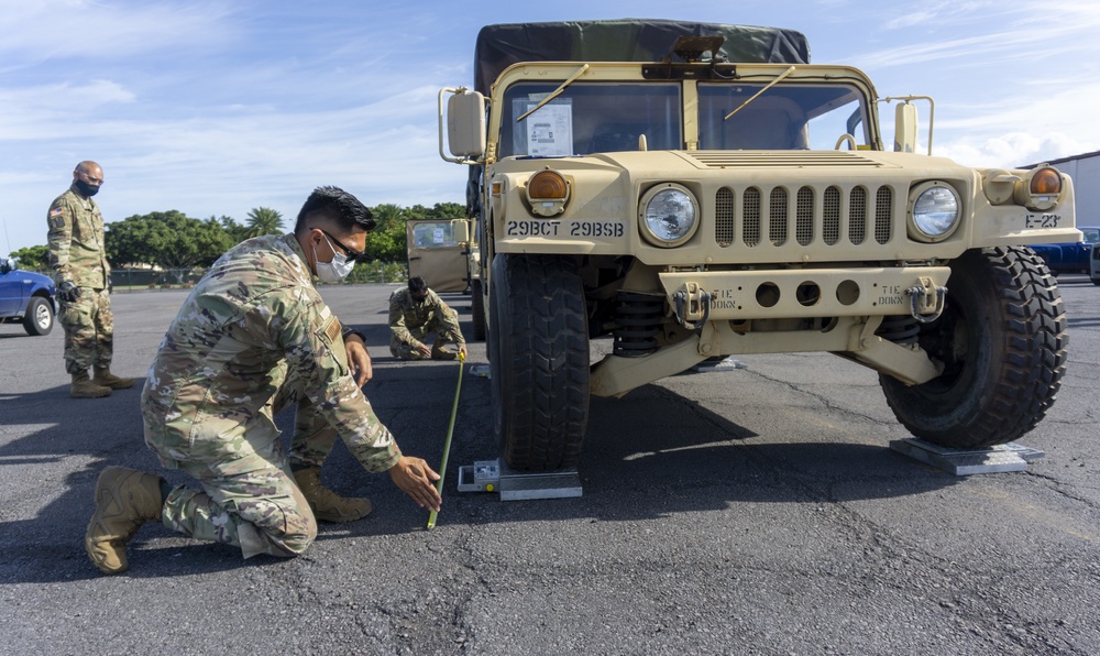 Soldiers and Airmen hold joint inspection for vehicle airlift op