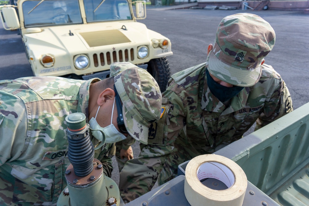 Soldiers and Airmen hold joint inspection for vehicle airlift op