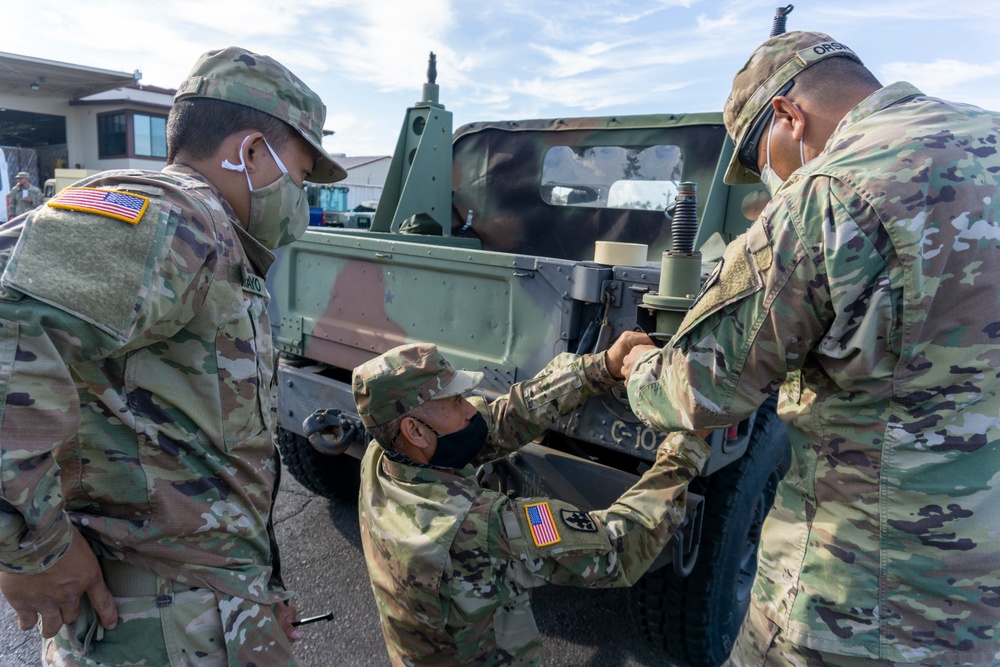 Soldiers and Airmen hold joint inspection for vehicle airlift op