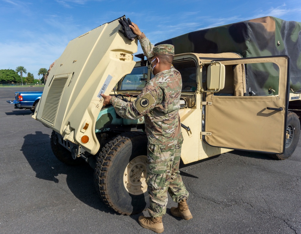 Soldiers and Airmen hold joint inspection for vehicle airlift op