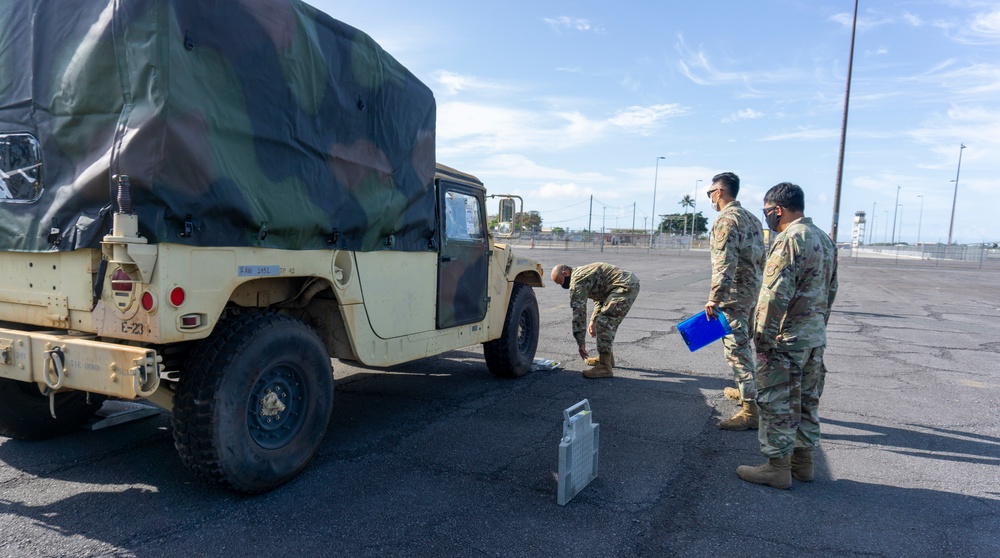 Soldiers and Airmen hold joint inspection for vehicle airlift op