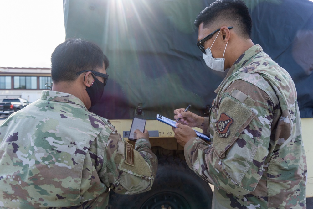 Soldiers and Airmen hold joint inspection for vehicle airlift op