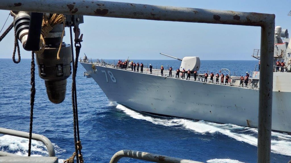 USNS Supply maintains course and speed as USS Porter comes alongside