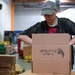 Airmen volunteer to pack food boxes at food bank