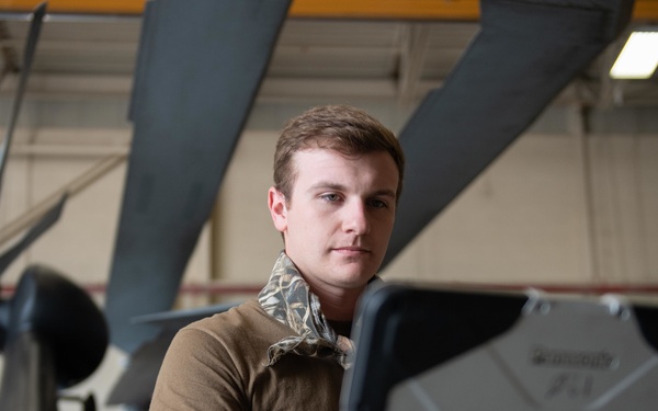 Sailor does maintenance on MH-60S Sea Hawk