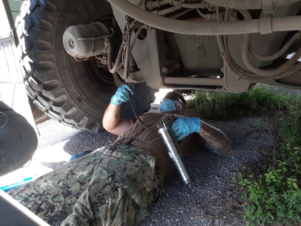 U.S. Navy Seabees with NMCB-5’s Detail Tinian build Southwest Asian huts