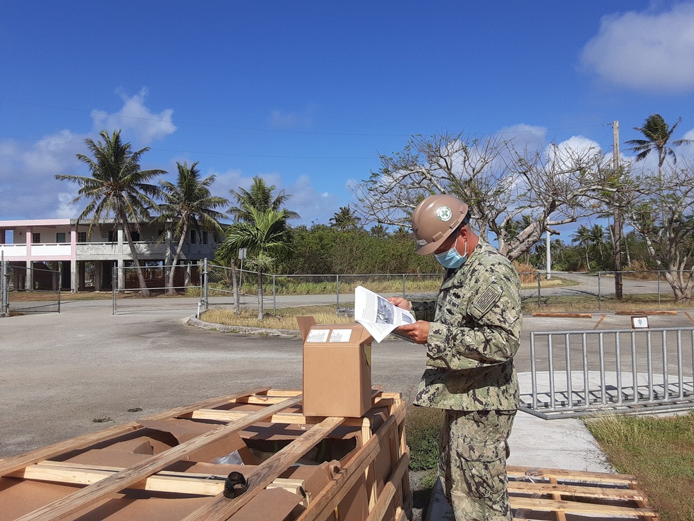 U.S. Navy Seabees with NMCB-5’s Detail Tinian build Southwest Asian huts