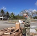 U.S. Navy Seabees with NMCB-5’s Detail Tinian build Southwest Asian huts