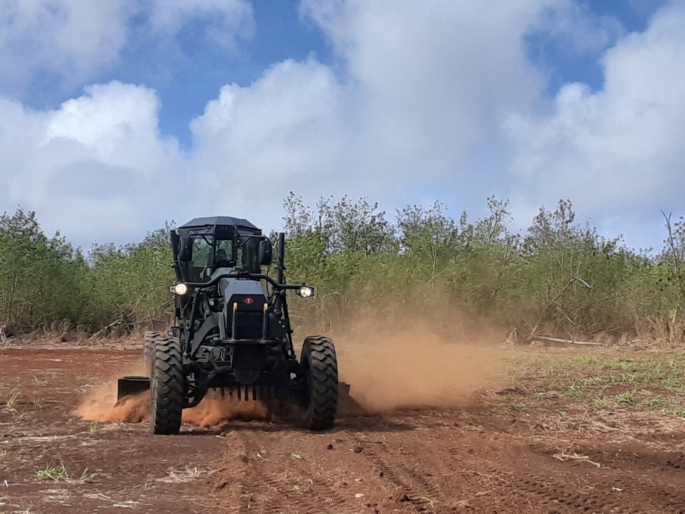 U.S. Navy Seabees with NMCB-5’s Detail Tinian build Southwest Asian huts