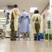 USNS Mercy Sailors Walk Alongside Patient