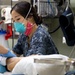 USNS Mercy Sailor Treats Patient