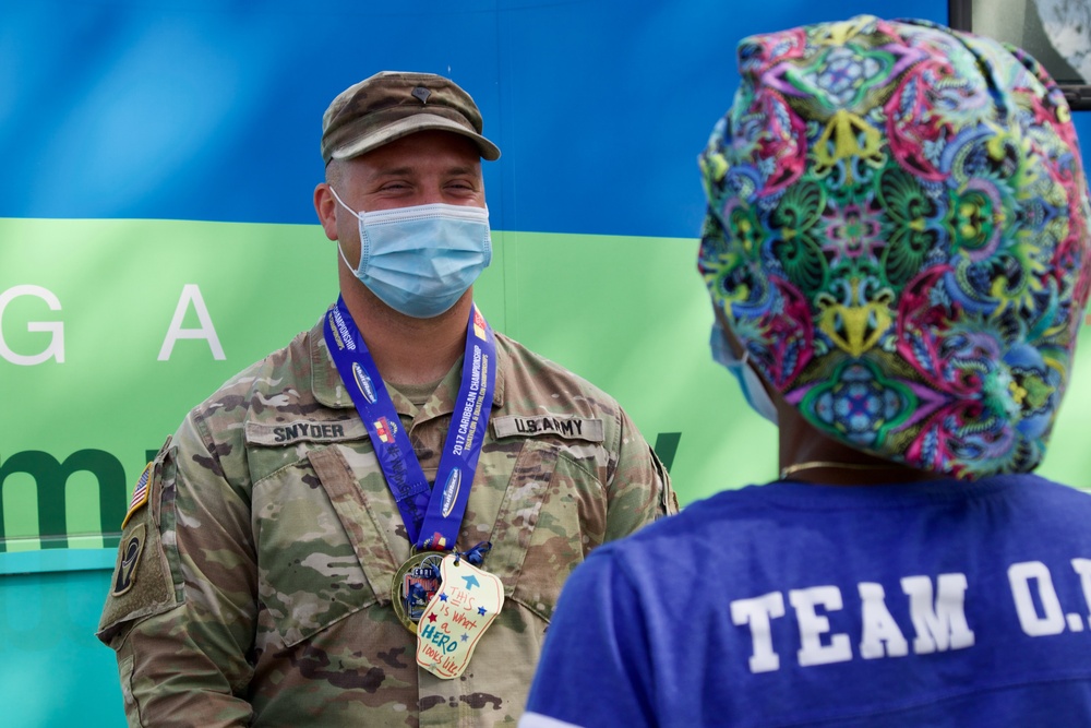 Children personalize medals for Florida National Guard service members and partners