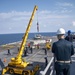 USS America (LHA 6) conducts crane operations