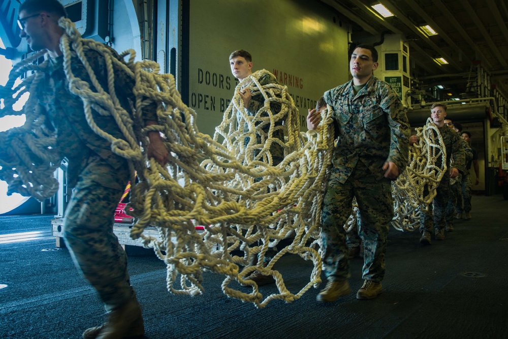 31st MEU Marines conduct tactical cargo net debarkation rehearsal from USS America in the East China Sea