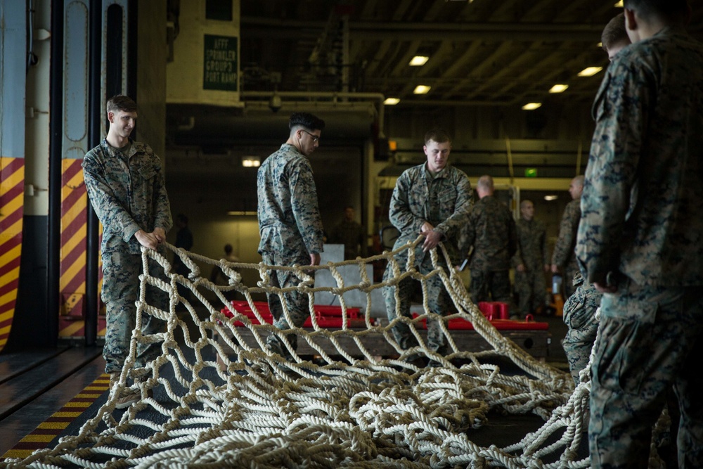 31st MEU Marines conduct tactical cargo net debarkation rehearsal from USS America in the East China Sea