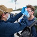 Sailors Return to USS Theodore Roosevelt After Completion of Quarantine