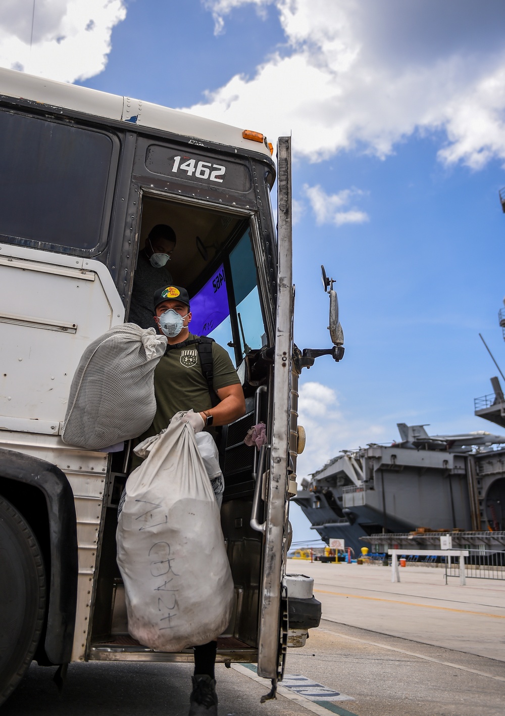 Sailors Return to USS Theodore Roosevelt After Completion of Quarantine