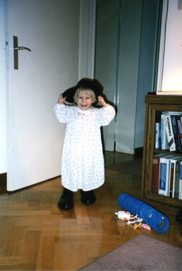 Army brat wears dad's boots and cap