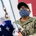 USNS Mercy Sailor Prepares to Raise the National Ensign