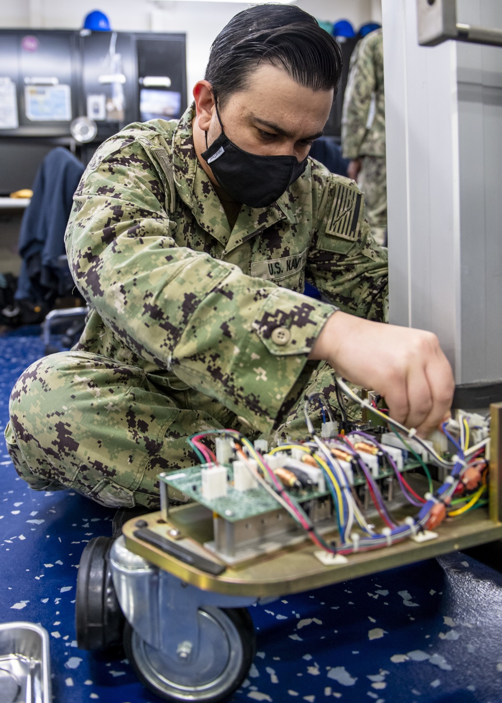 USNS Mercy Sailor Repairs Medical Equipment