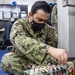 USNS Mercy Sailor Repairs Medical Equipment