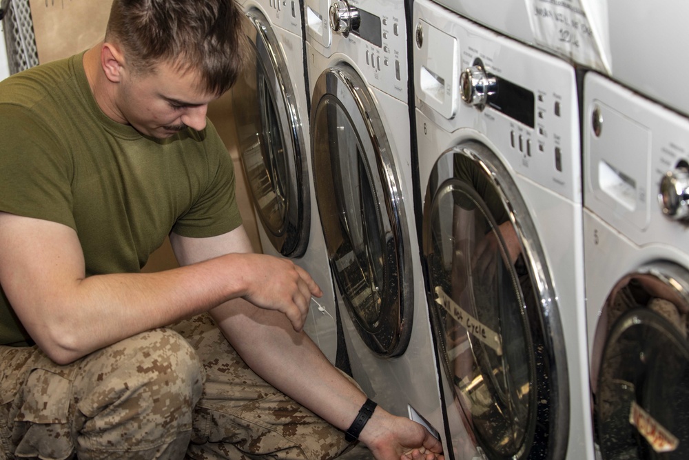 Marines help in ships laundry