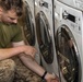 Marines help in ships laundry