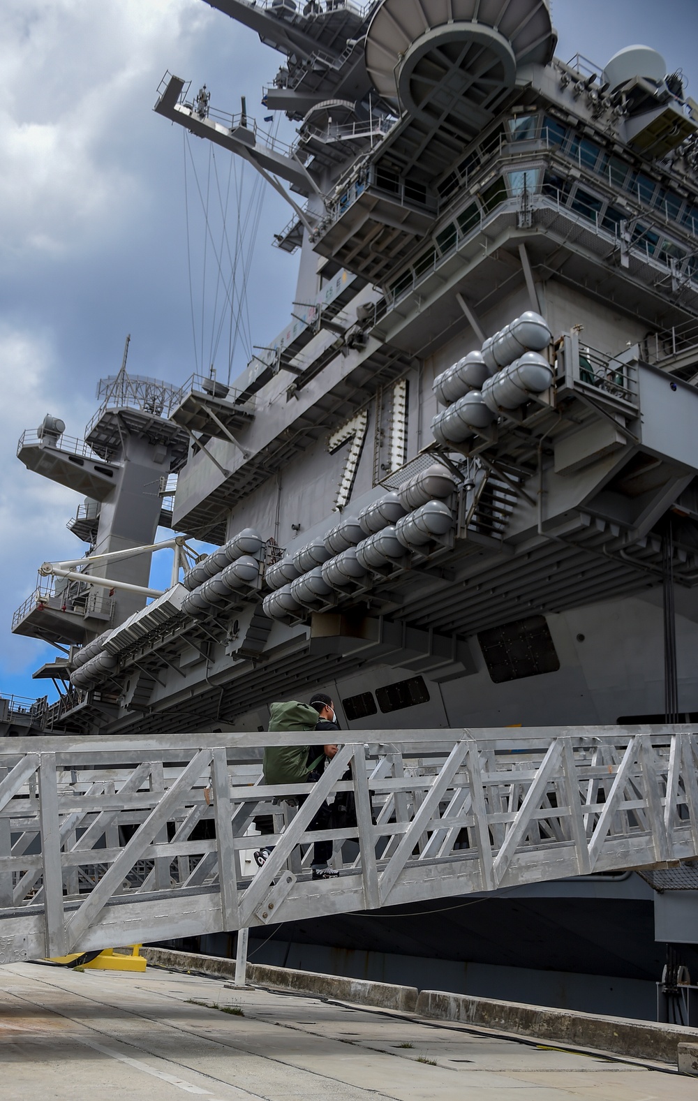 USS Theodore Roosevelt Sailors Return to Ship After Quarantine