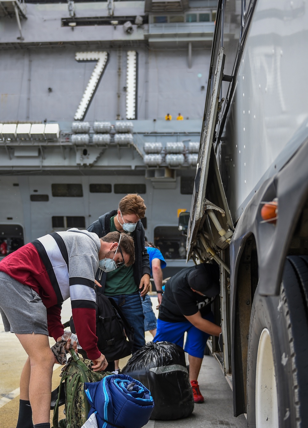 USS Theodore Roosevelt Sailors Return to Ship After Quarantine