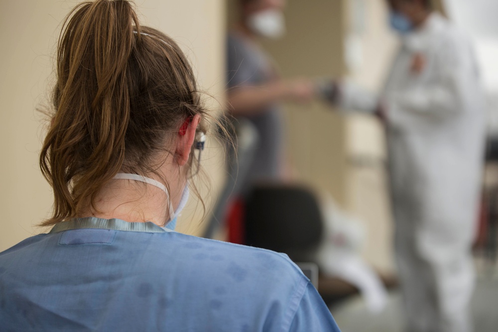 3rd Medical Battalion Sailors conduct daily medical checks with USS Theodore Roosevelt Sailors