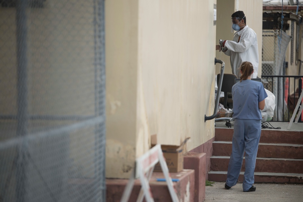 3rd Medical Battalion Sailors conduct daily medical checks with USS Theodore Roosevelt Sailors