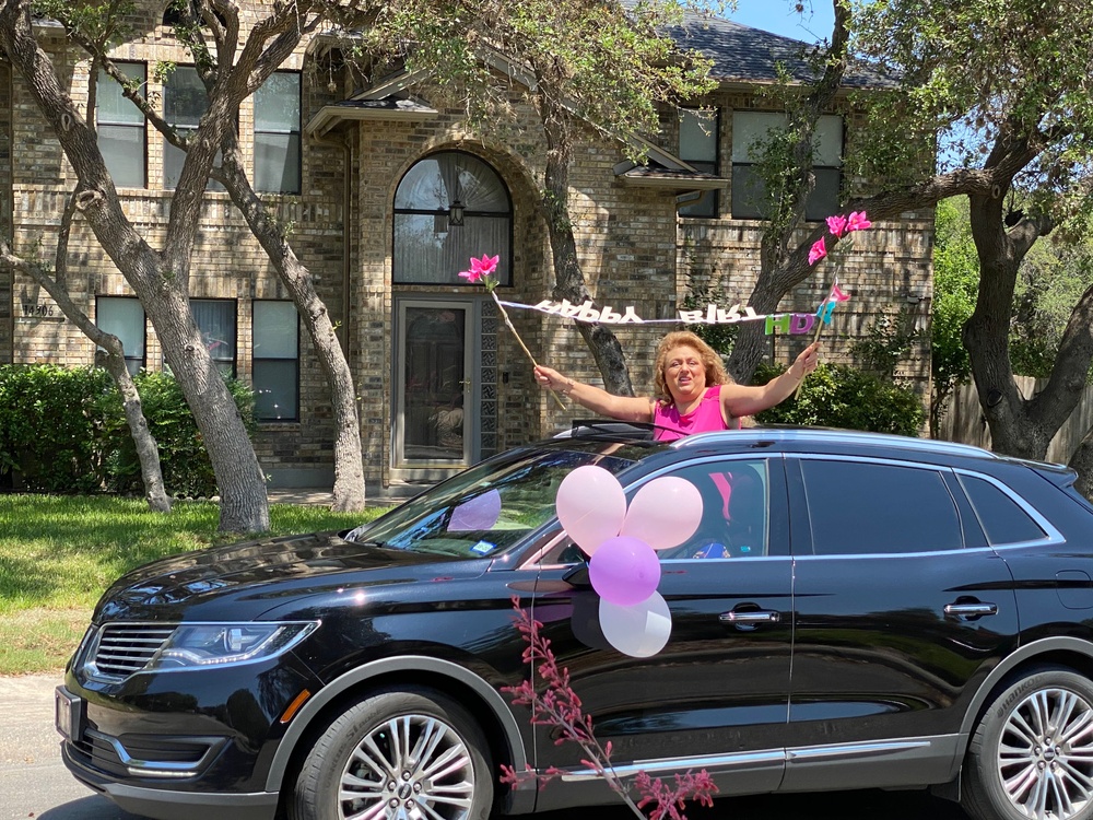 Healthcare workers deliver birthday cheer to cancer survivor