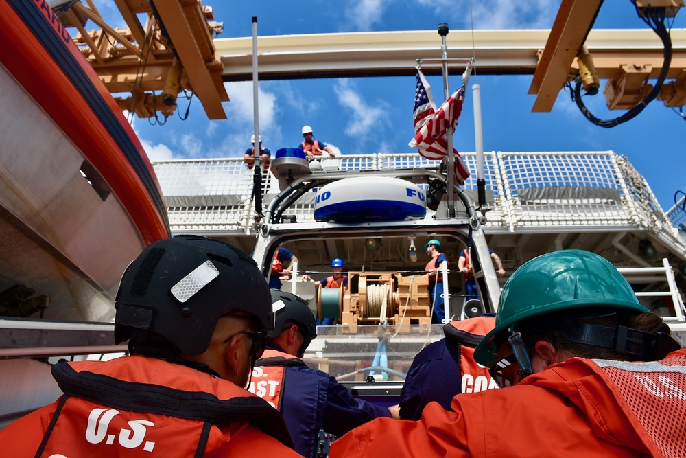 Coast Guard Cutter Midgett recovers small boat crew