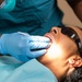 USNS Mercy Sailor Performs Dental Assessment
