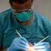 USNS Mercy Sailor Performs Dental Assessment