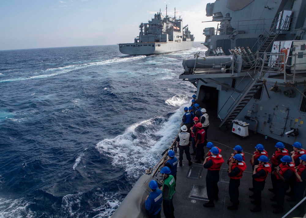 USS Mustin Conducts Replenishment At Sea