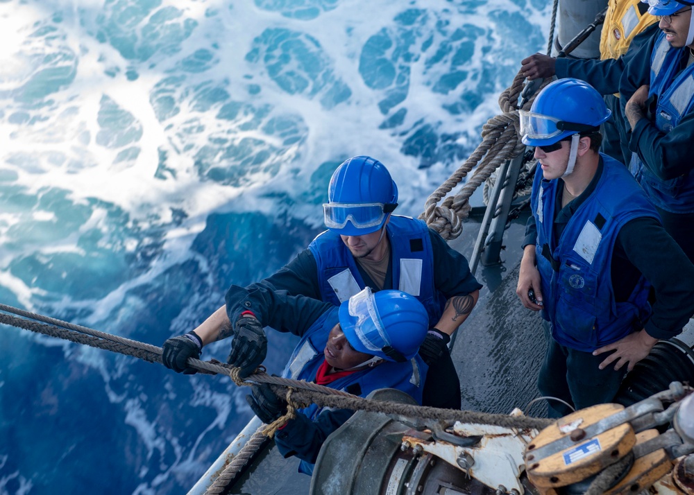 USS Mustin Conducts Replenishment At Sea