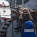 USS Mustin Conducts Replenishment At Sea