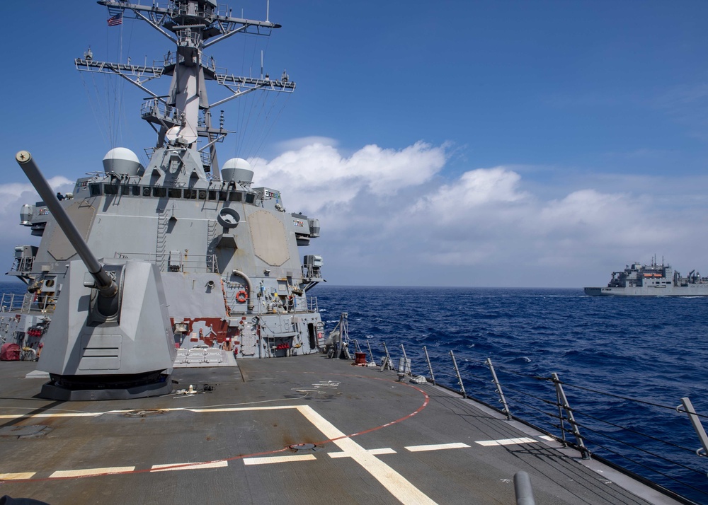 USS Mustin Conducts Replenishment At Sea
