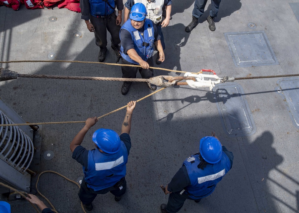 USS Mustin Conducts Replenishment At Sea