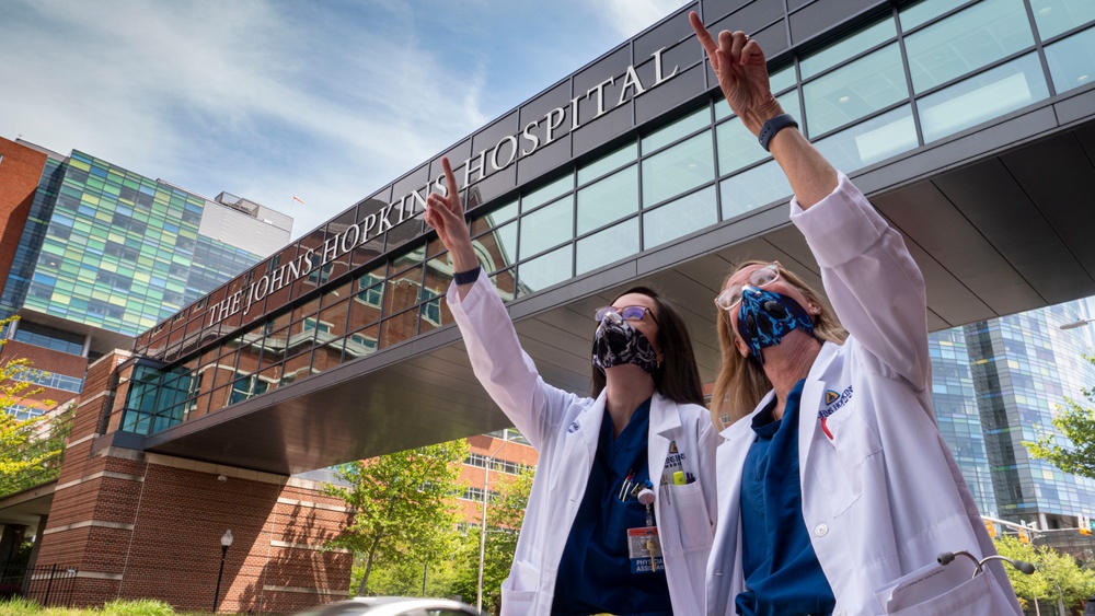 The Navy Blue Angels and Air Force Thunderbirds perform a joint flyover for healthcare workers in Baltimore