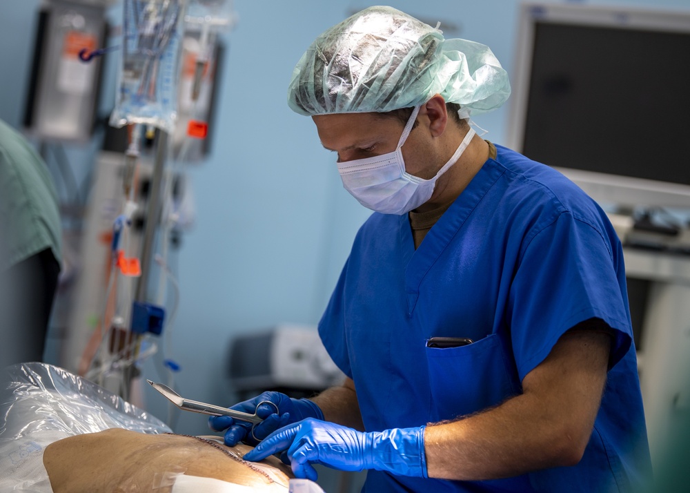 USNS Mercy Sailor Inspects Staples