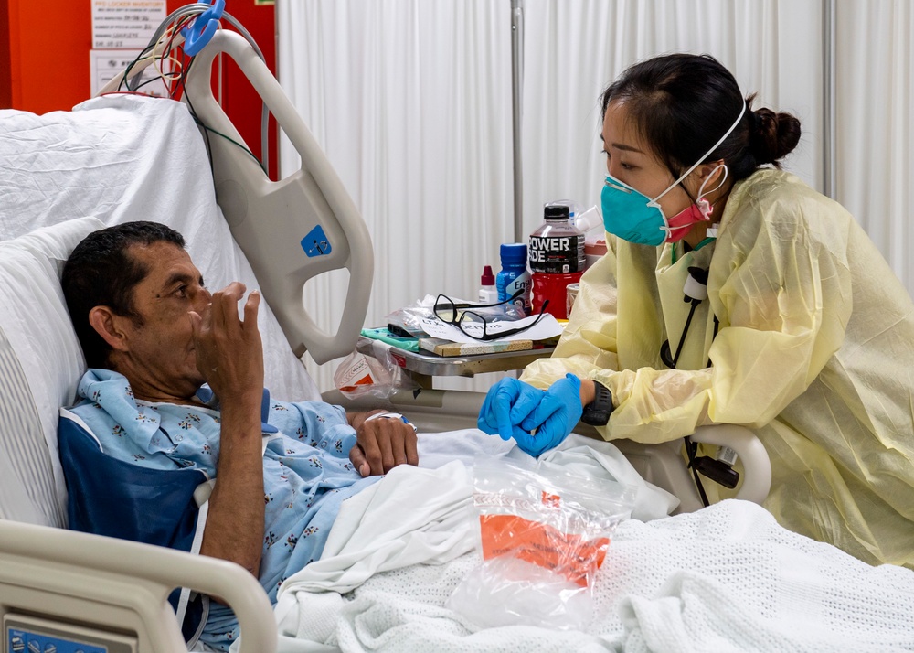 USNS Mercy Sailor Treats Patient