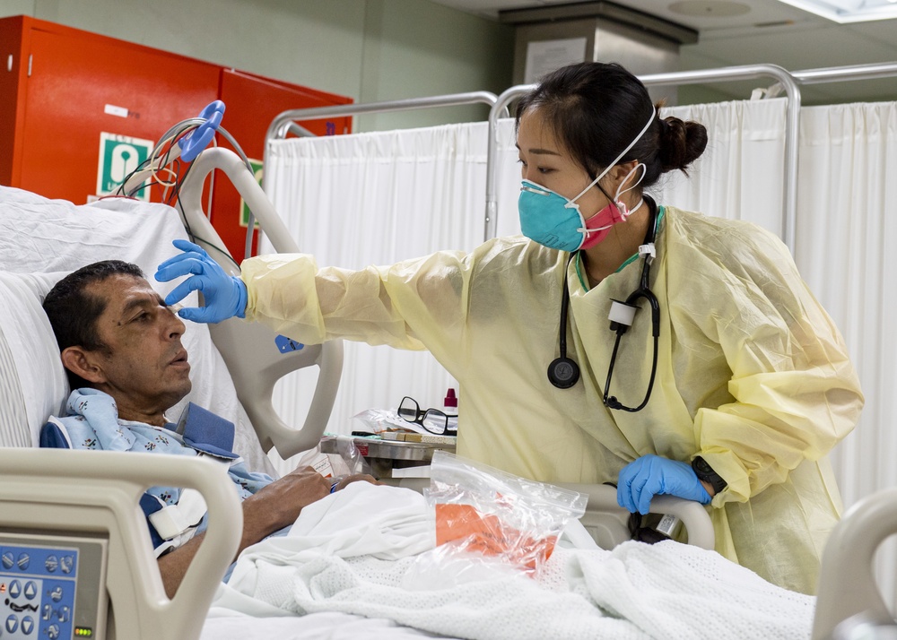 USNS Mercy Sailor Treats Patient