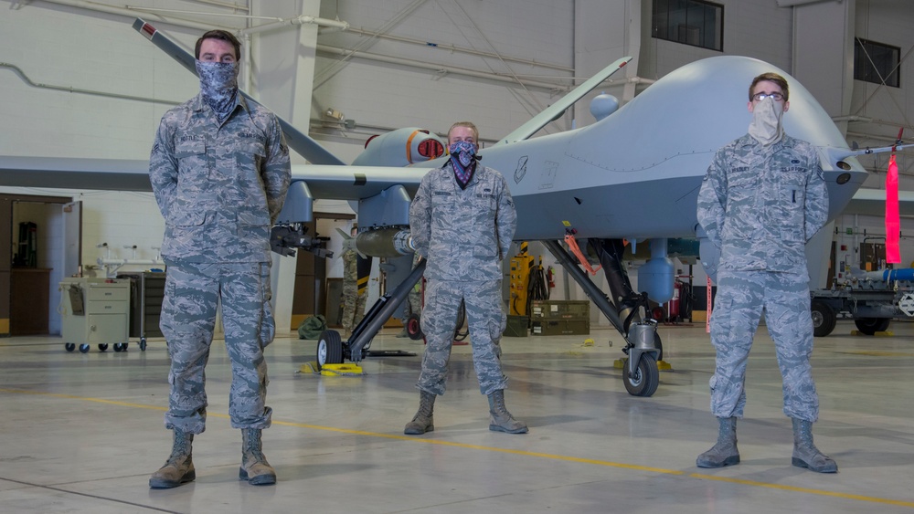 9th AMU pose and MQ-9 Reaper