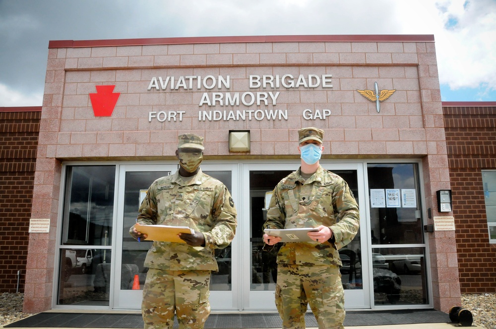 Two Soldiers helping to prevent the spread of COVID-19