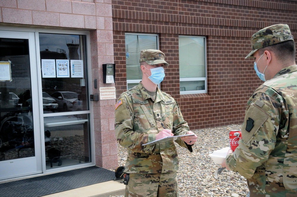 Two Soldiers helping to prevent the spread of COVID-19