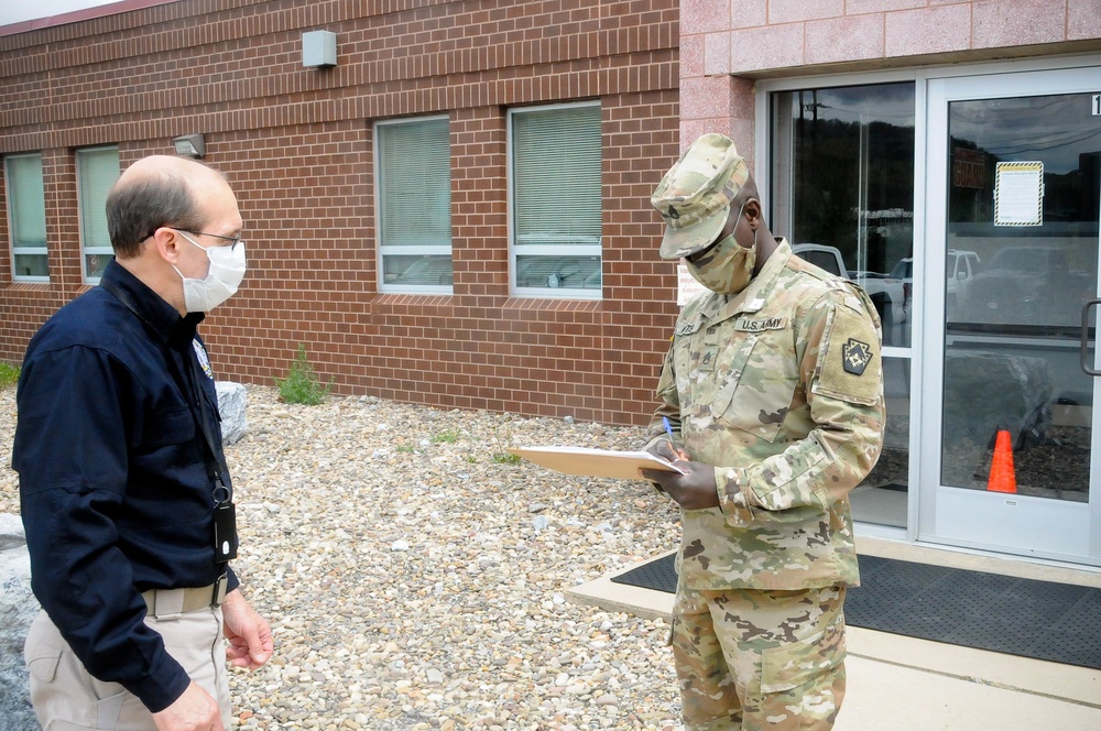 Two Soldiers helping to prevent the spread of COVID-19