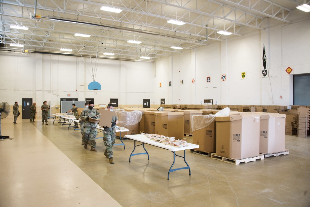 Kansas Army National Guard Soldiers prepare hunger relief boxes for Wichita Food Bank